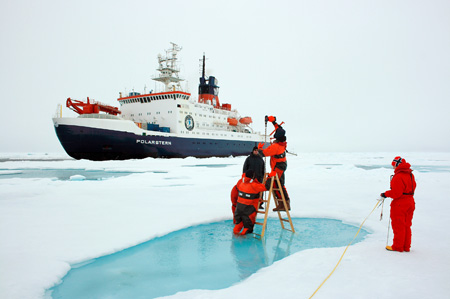 AWI researcher measuring the thickness of the ice during the 26th Arctic expedition aboard the Polarstern. Photo: Stefan Hendricks/AWI